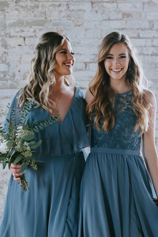 Pair of bridesmaids wear Kennedy Blue chiffon dresses in slate blue